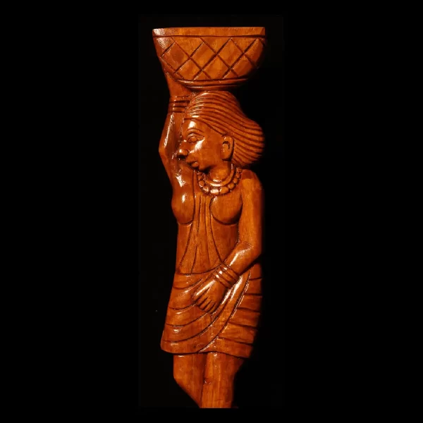 woman holding a basket wood art work