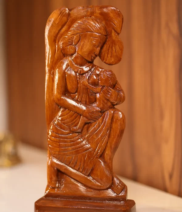 wood artwork featuring a mother and baby