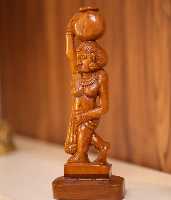 wood artwork of a woman with a pot