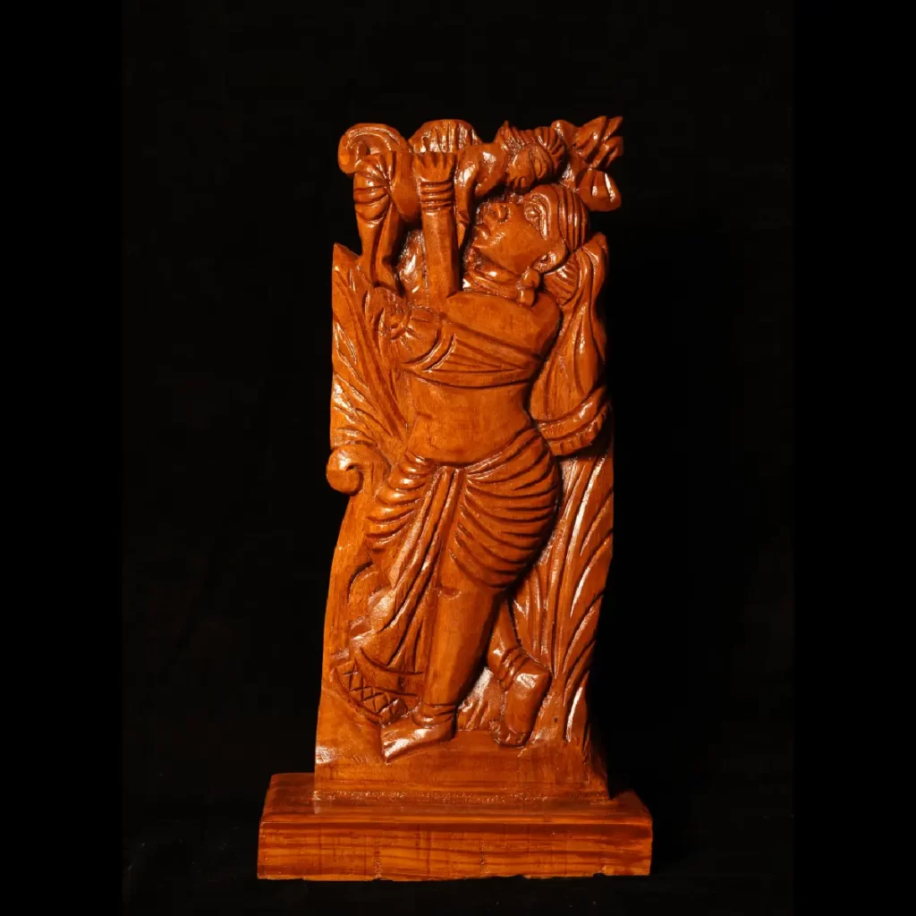 wooden art piece depicting a mother and baby