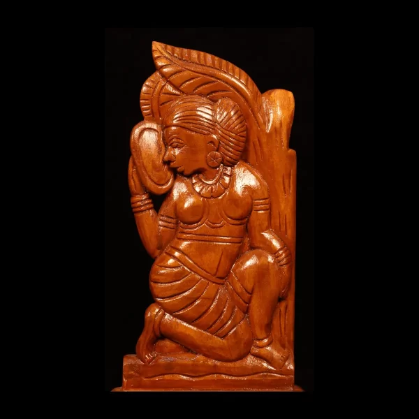 wooden artwork featuring a female figure and a mirror