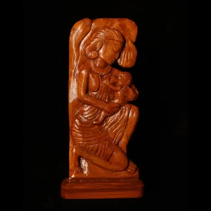 wooden artwork featuring a mother and baby